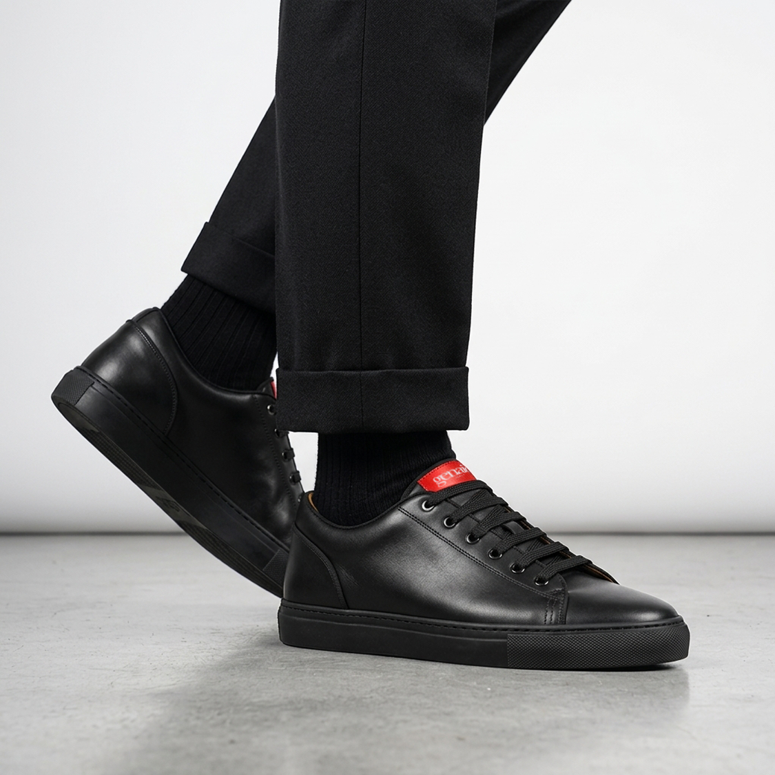 INIZIO All Black Leather worn with black tailormade woolen trousers and black ribbed cashmere socks